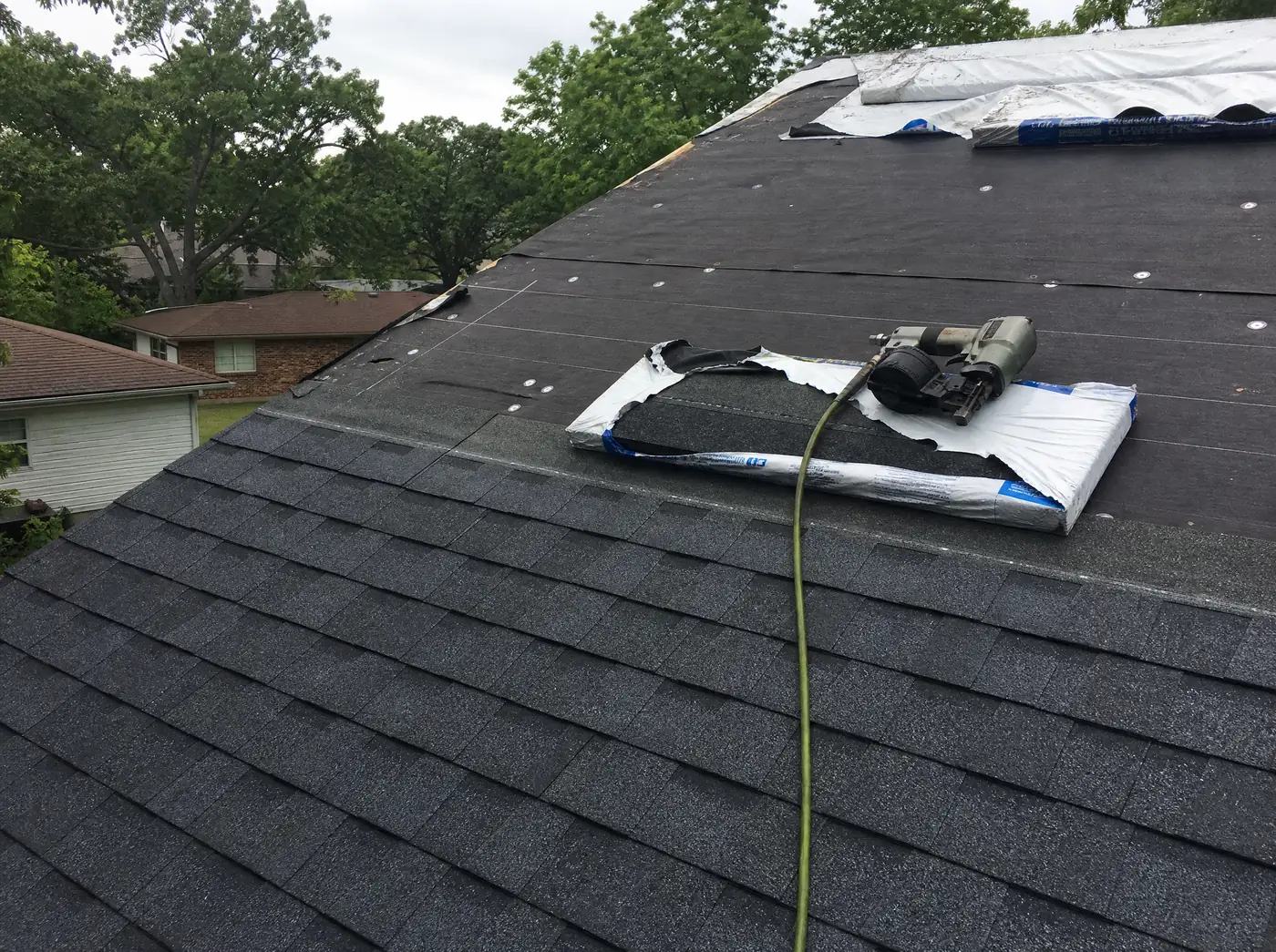 Architectural asphalt shingles being installed on a Springfield Missouri roof