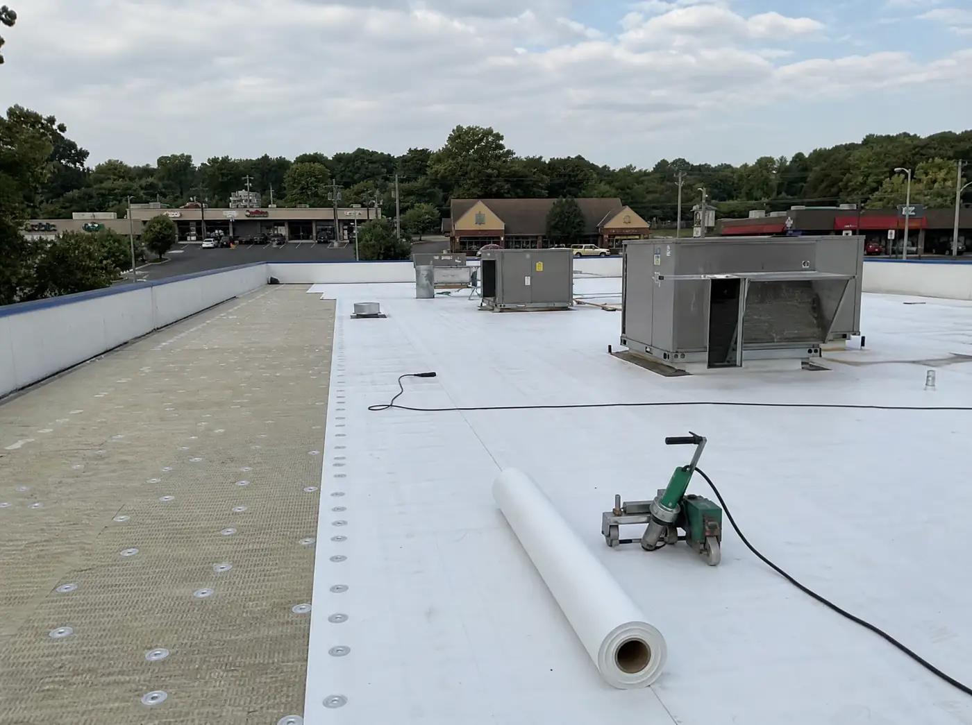TPO membrane commercial roof installation on a Springfield MO building