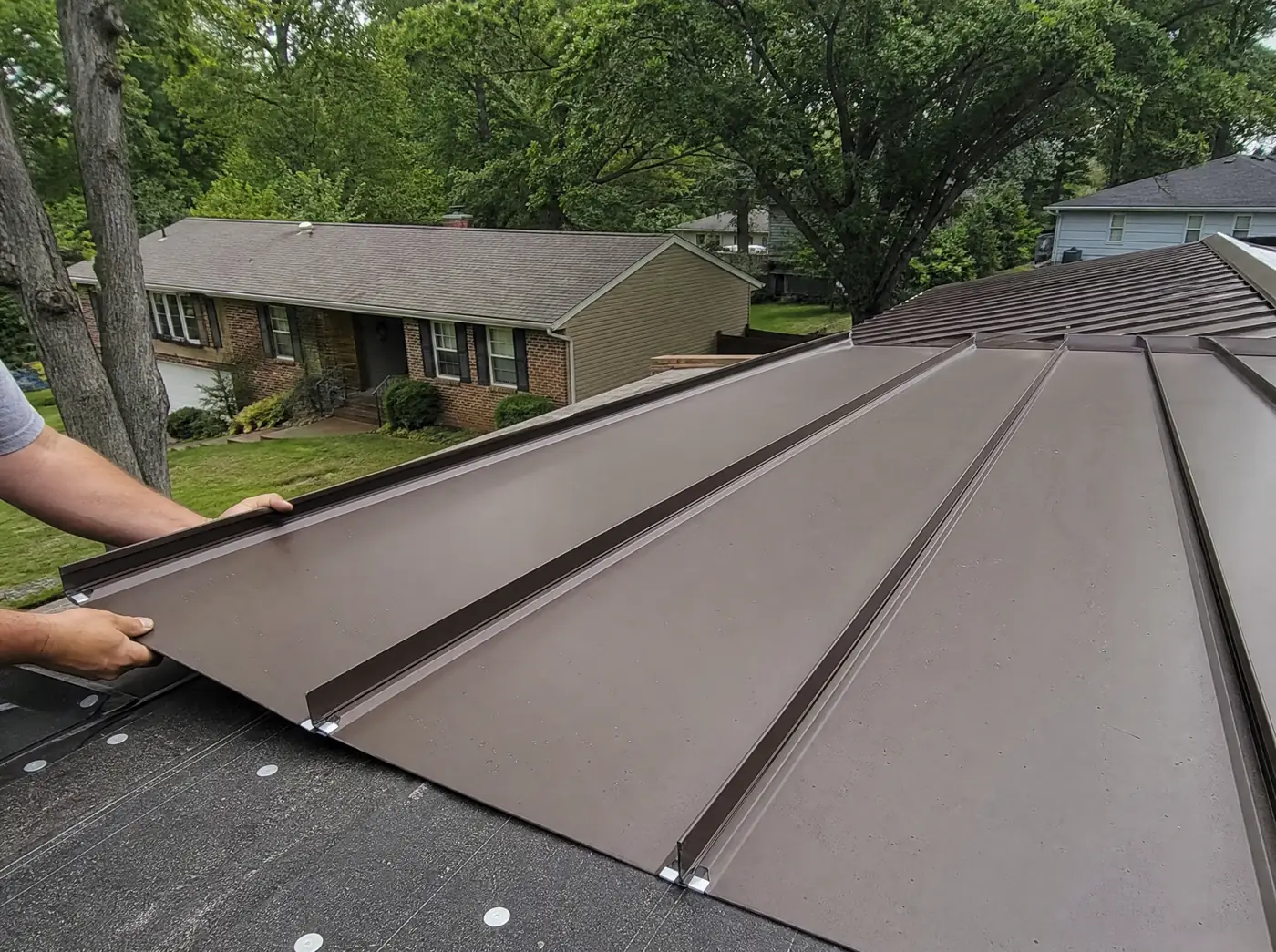 Standing seam metal roof installation on a home near Springfield MO