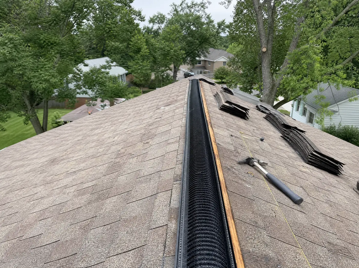 Continuous ridge vent being installed on a Springfield MO roof
