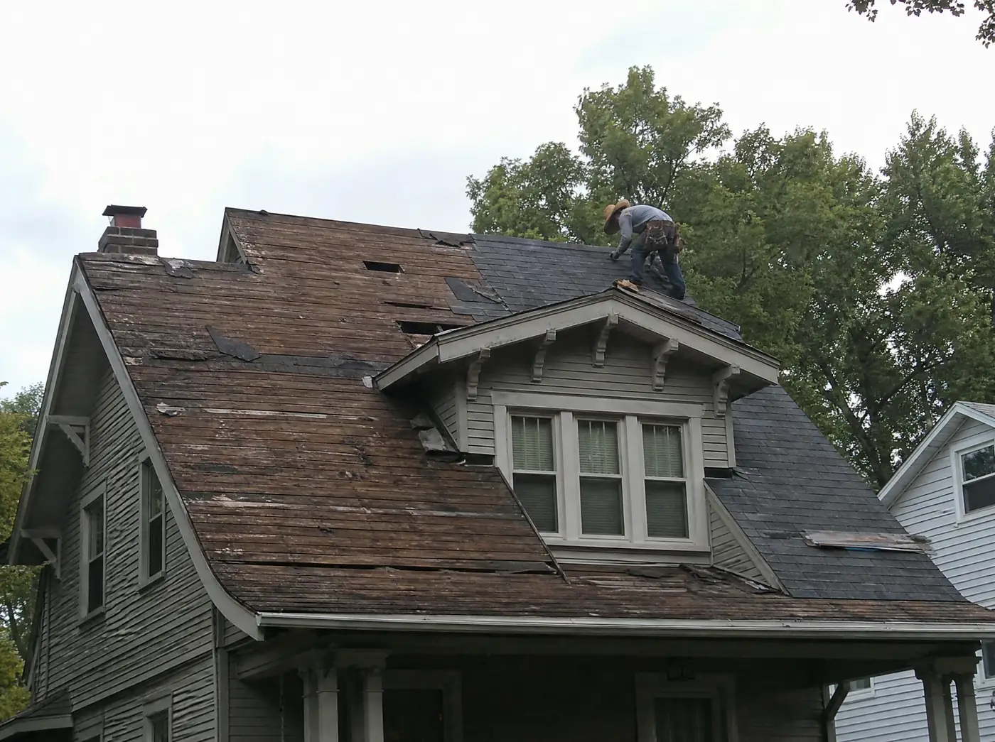 Hail damaged roof on an older home in Aurora, Lawrence County Missouri