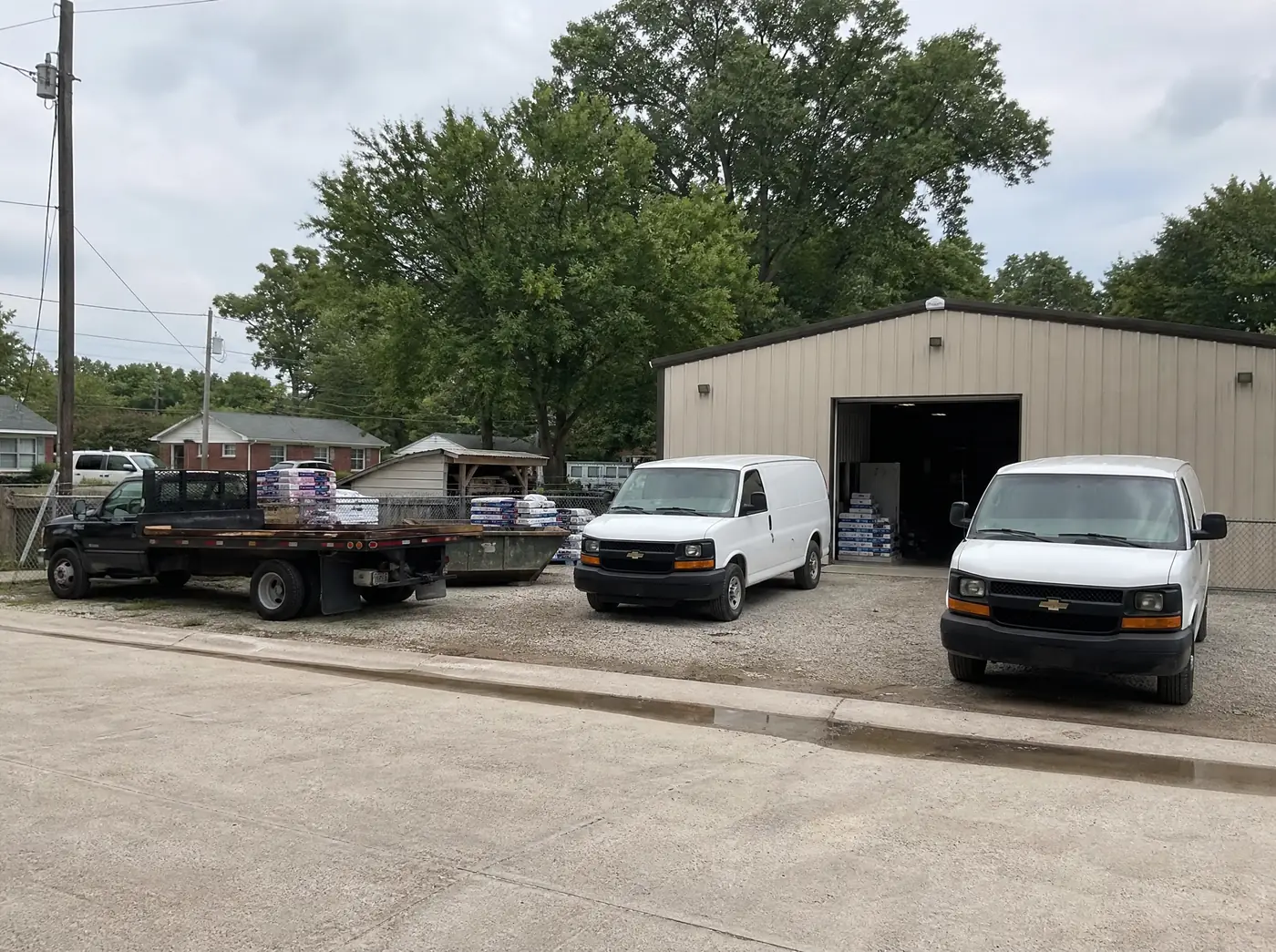 The Roofing Contractors Springfield MO shop and trucks on South Union Avenue