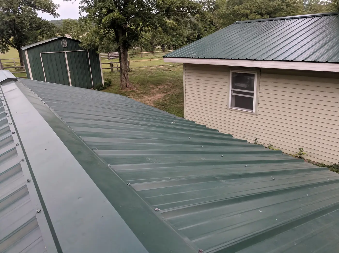 Metal roof and outbuilding on an acreage property near Fair Grove MO